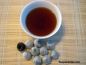 Preview: China Mini Tuo Cha feinster Pu Erh Tee 15 J. alt - 10 Stck 45 g.